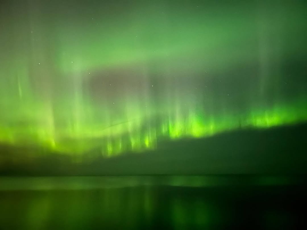 Photo of Green northern lights in Michigan by Jenna Myers Photography